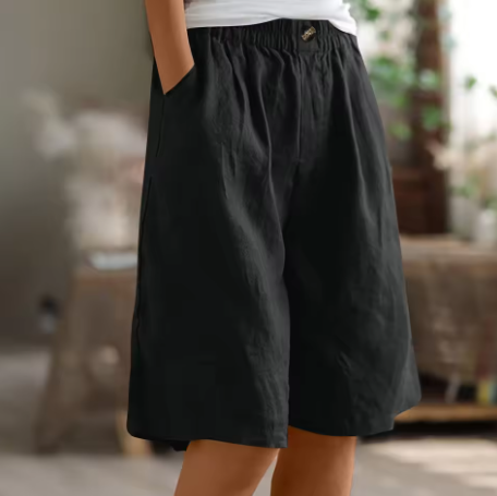 Elastic-waist mid-thigh shorts in black, buttoned elastic waistband, relaxed fit