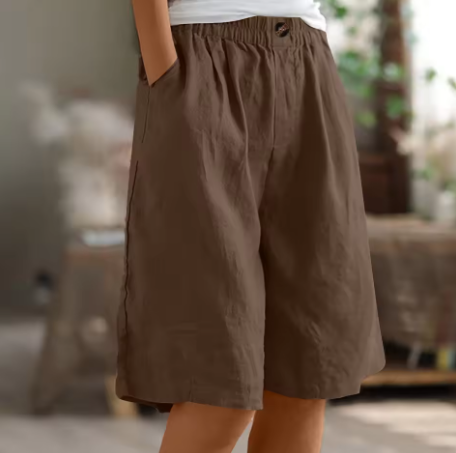 Brown elastic waist mid-thigh shorts with button detail, loose fit
