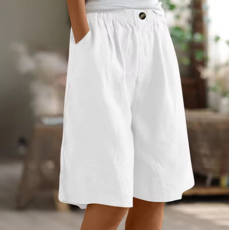 White elastic waist mid-thigh shorts with button detail, loose fit