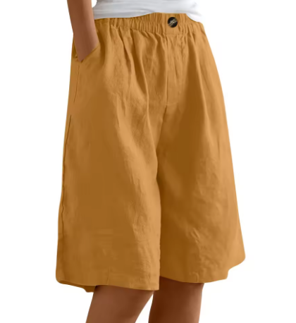 Mustard elastic waist mid-thigh shorts with button detail, loose fit