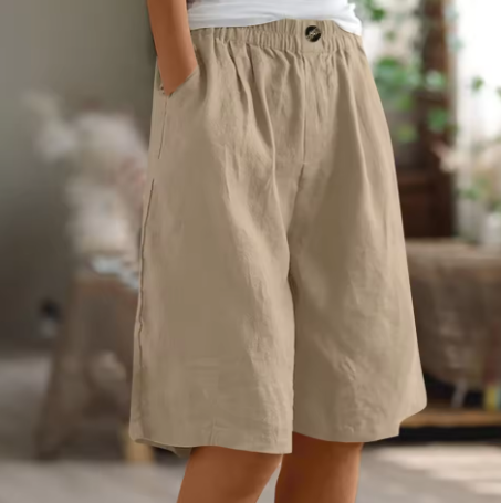Elastic-waist mid-thigh shorts in tan, buttoned elastic waistband, relaxed fit