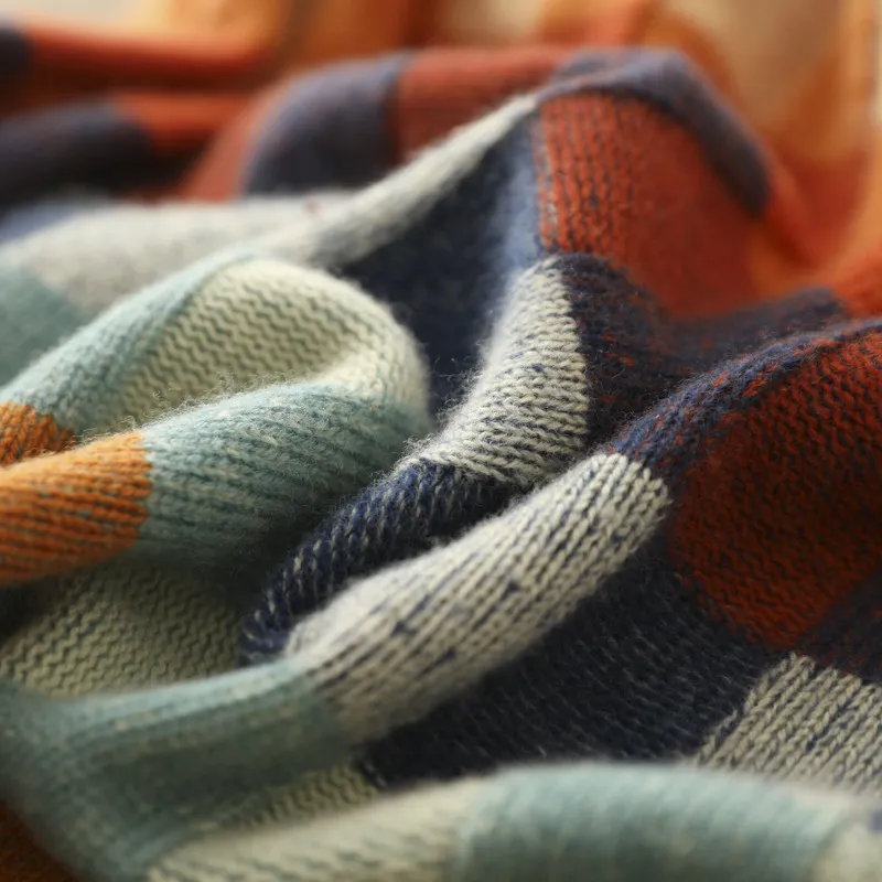 Multicolor checkered knit sweater fabric with visible ribbed texture