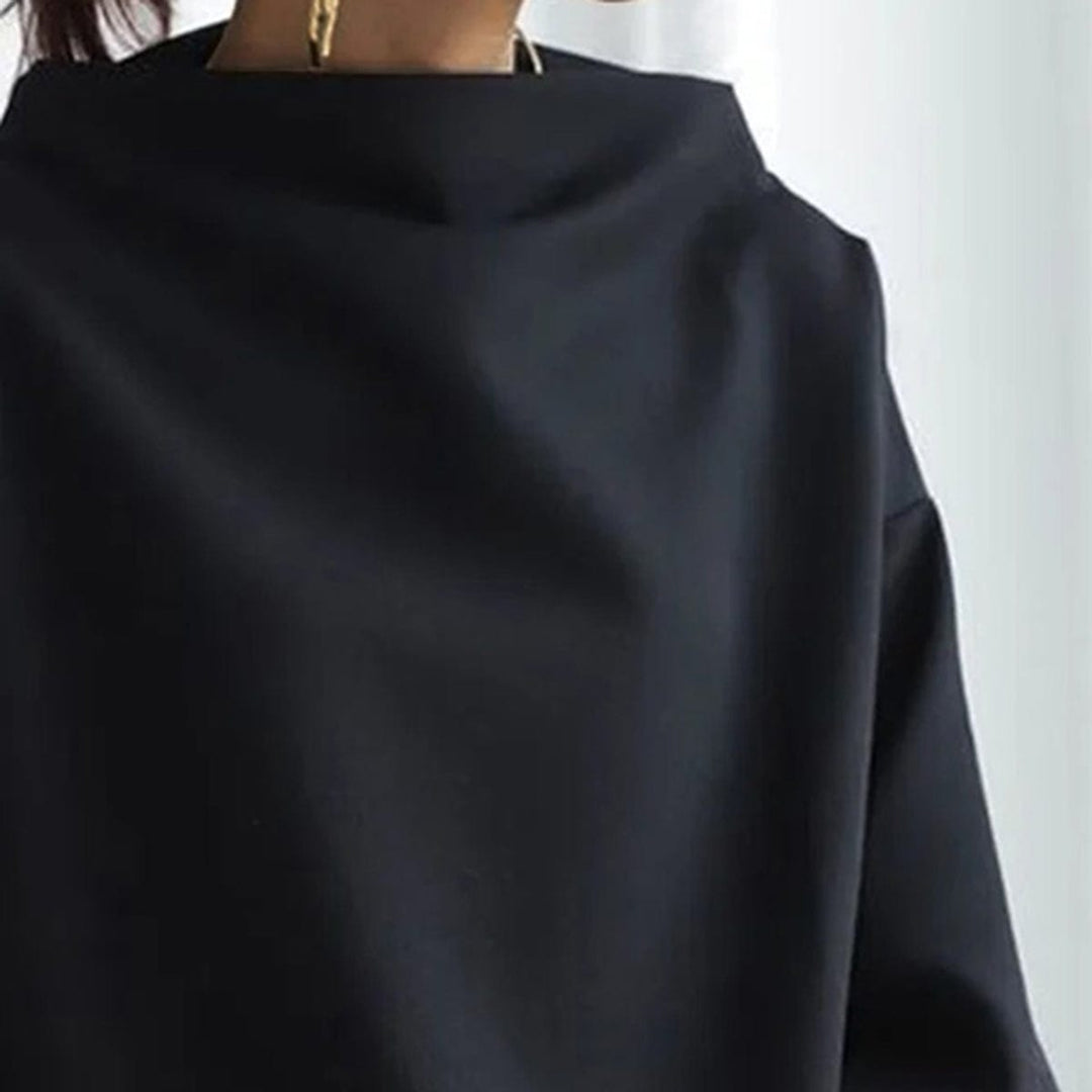 Black high-neck sweater close-up of neckline and smooth fabric texture