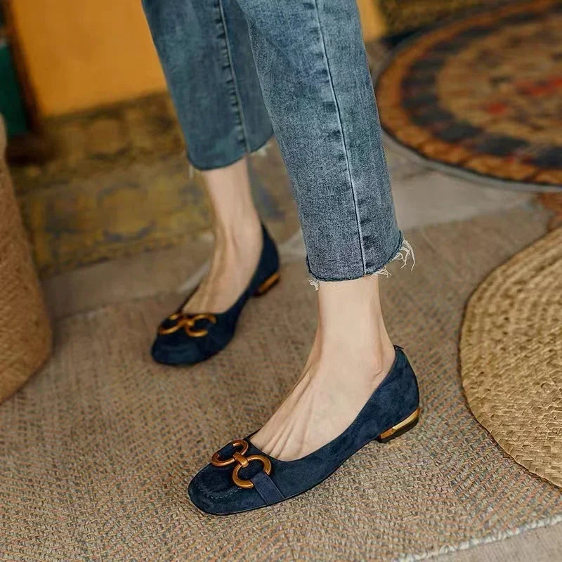 Blue ballet flats with gold chain-link detail and low heel