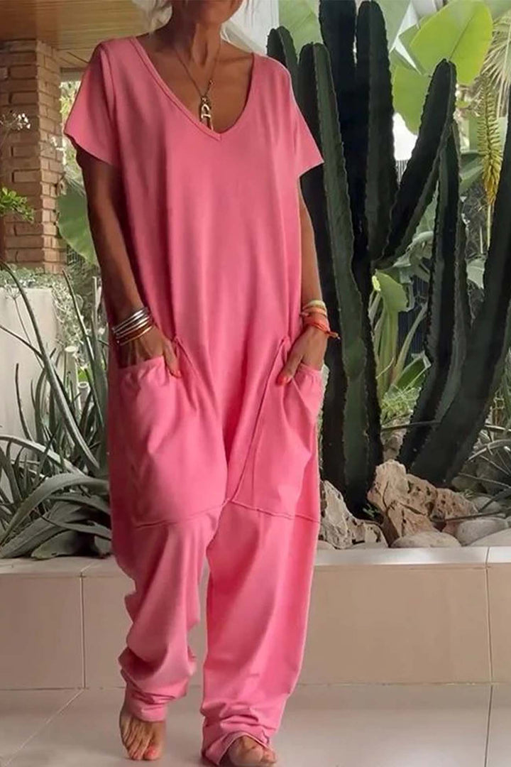 Coral pink relaxed pocket jumpsuit, short sleeves and V-neck with drawcord waist