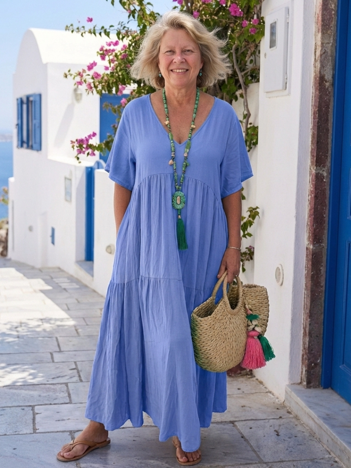 Blue tiered short-sleeve maxi dress with gathered bodice and layered skirt