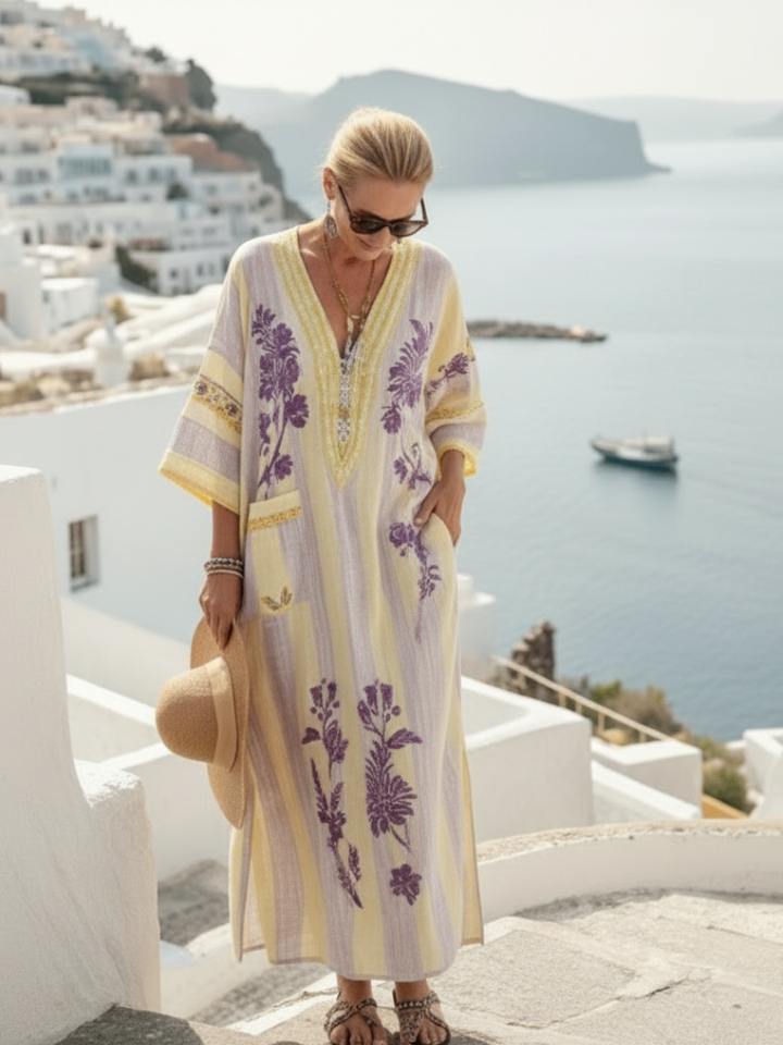 Beige V-neck maxi dress with purple floral embroidery and stripes, flowing half sleeves