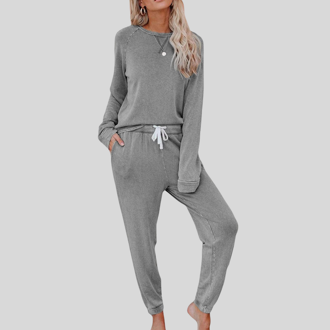 Light gray cozy lounge set: crewneck long-sleeve top and jogger pants with drawstring.
