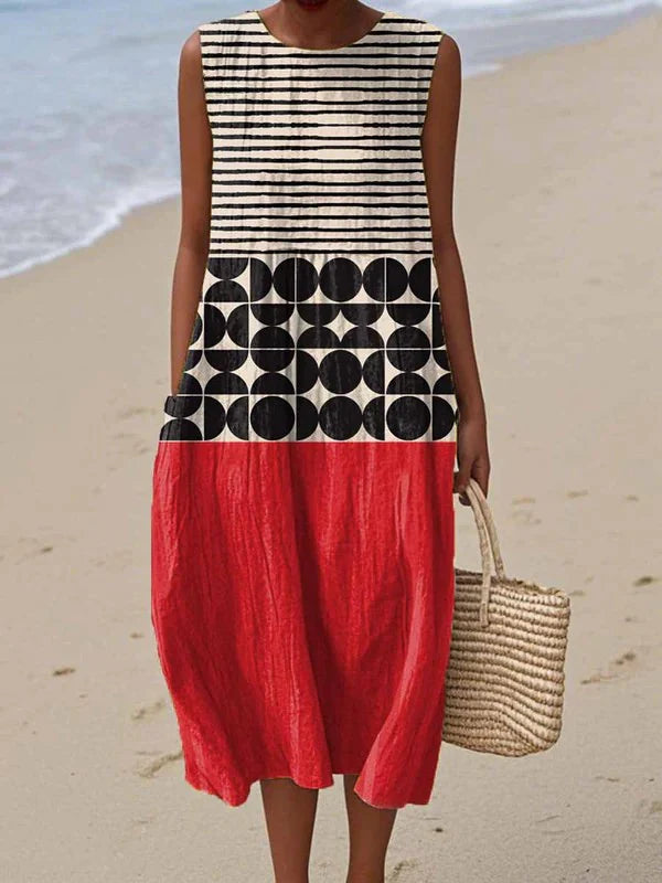 Sleeveless midi dress with striped upper bodice, circular pattern, and red tiered skirt