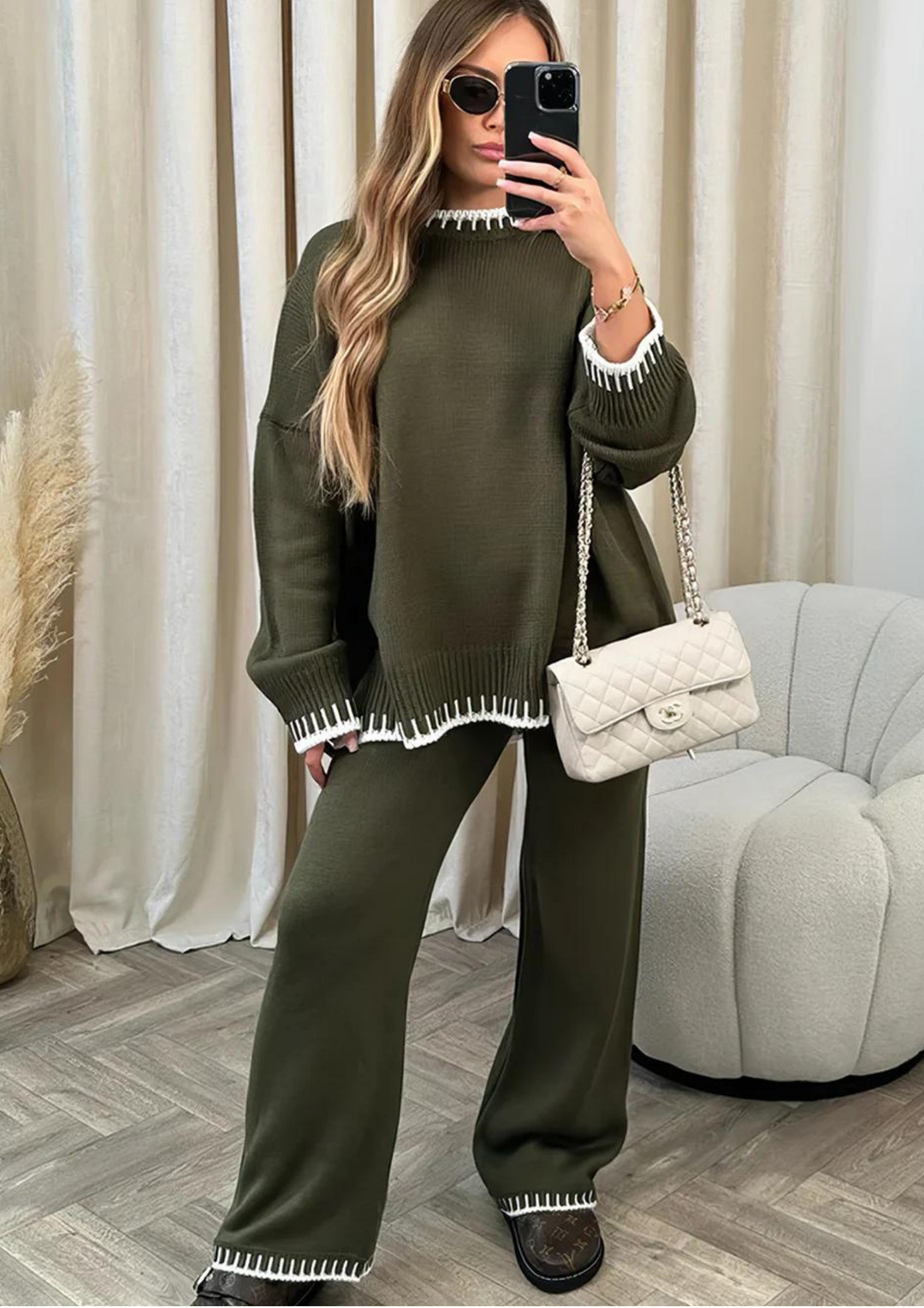 Olive green knit lounge set with long sleeve sweater and wide-leg pants, contrast striped cuffs