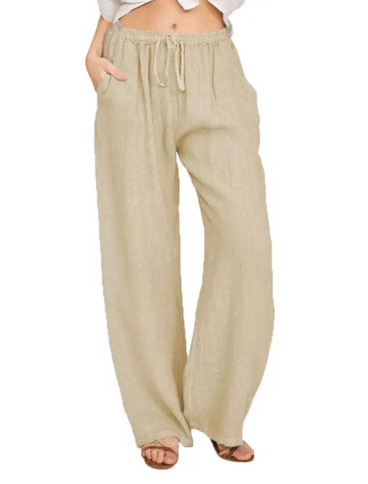 Khaki drawstring pants with elastic waist and relaxed wide-leg fit.