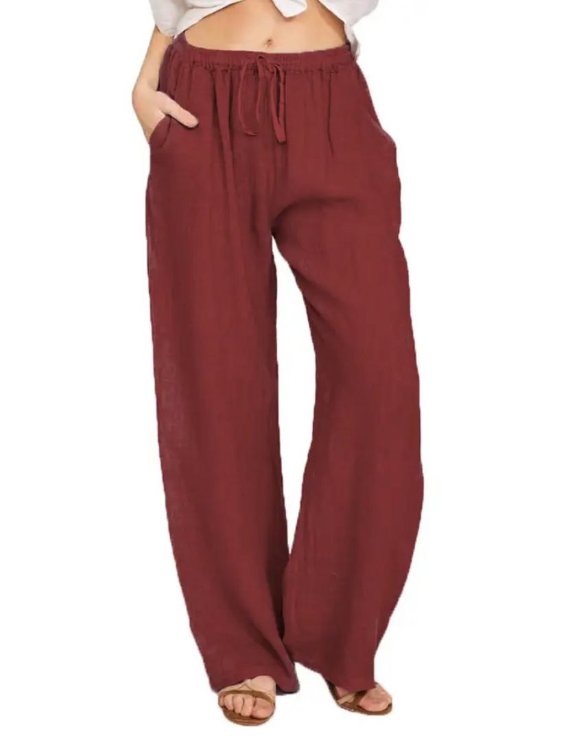 Burgundy drawstring pants, elastic waistband and relaxed wide-leg silhouette.