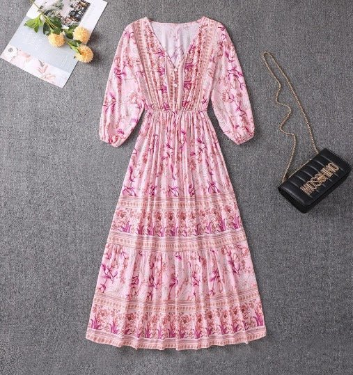 Pink floral boho midi dress with V-neck, long puff sleeves, tiered skirt