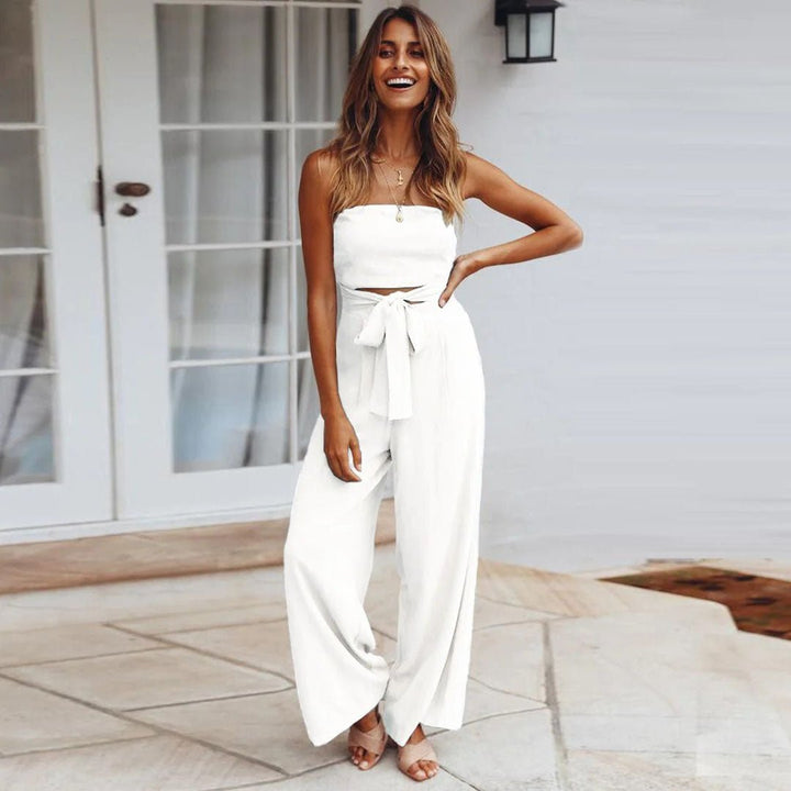 White strapless tie-waist jumpsuit with front waist tie and wide-leg fit