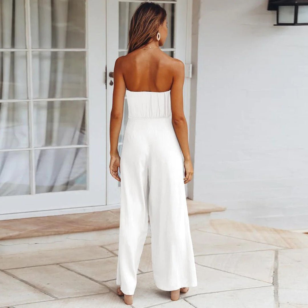 Back view of white strapless tie-waist jumpsuit with smocked back