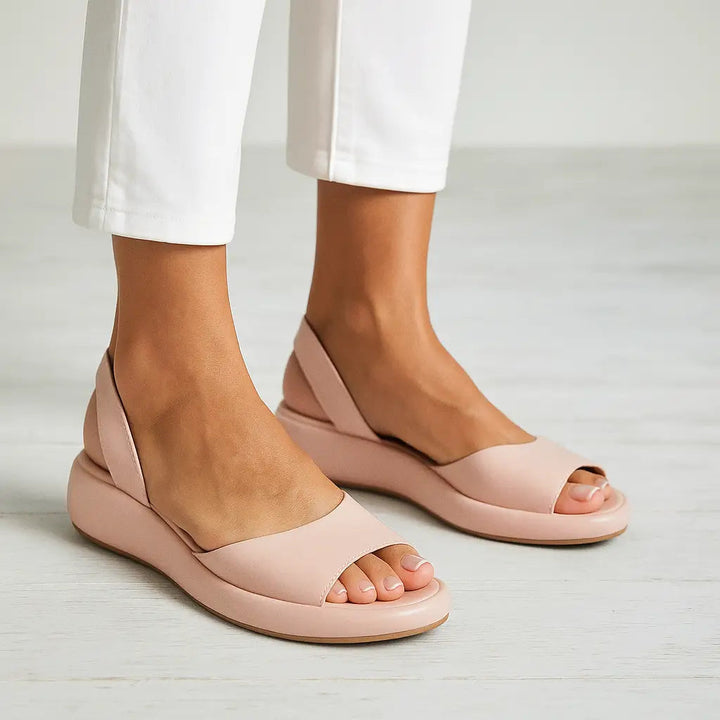 Light pink slide comfort sandals with open toe and wide straps