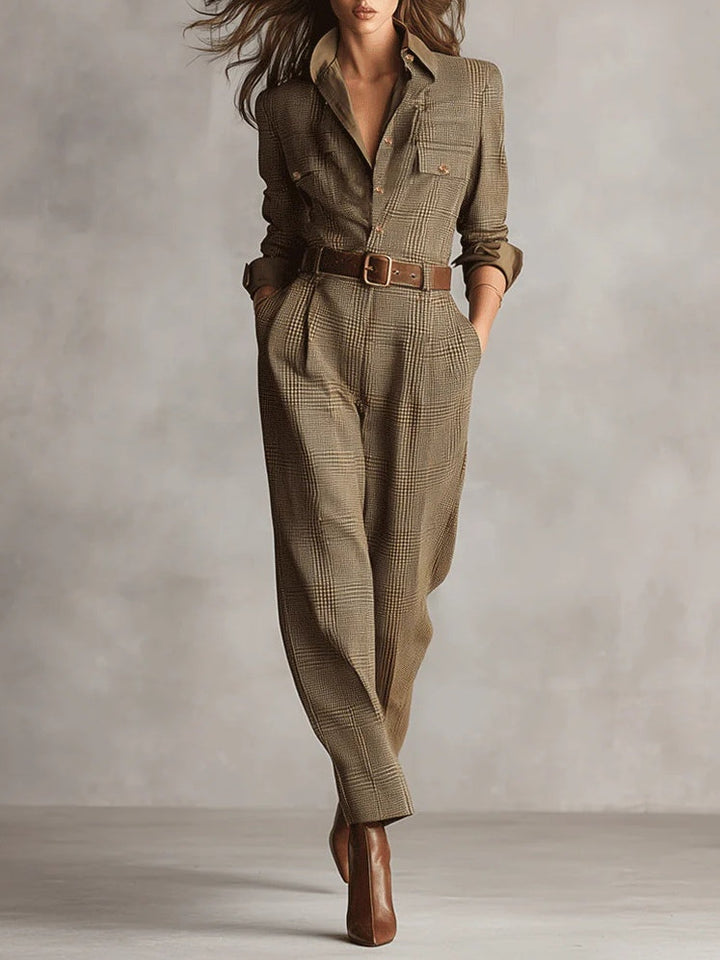 Tailored belted jumpsuit in brown plaid with long sleeves and collared neckline