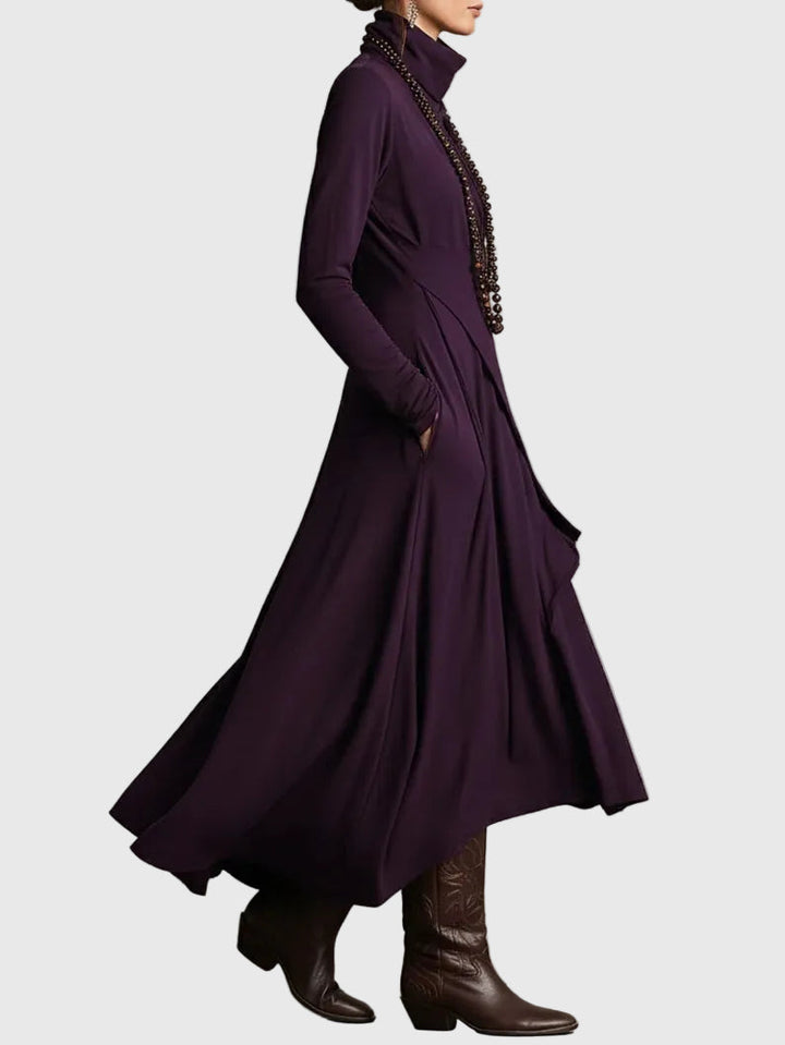 Purple draped turtleneck maxi dress, side view with long sleeves and flowing skirt
