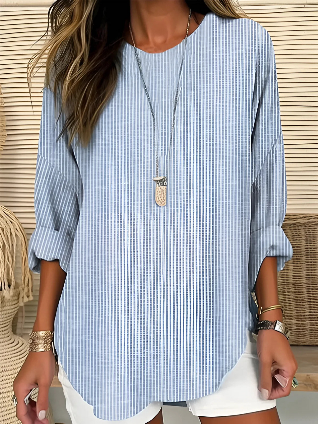 Blue pinstripe relaxed blouse with long sleeves and round neckline