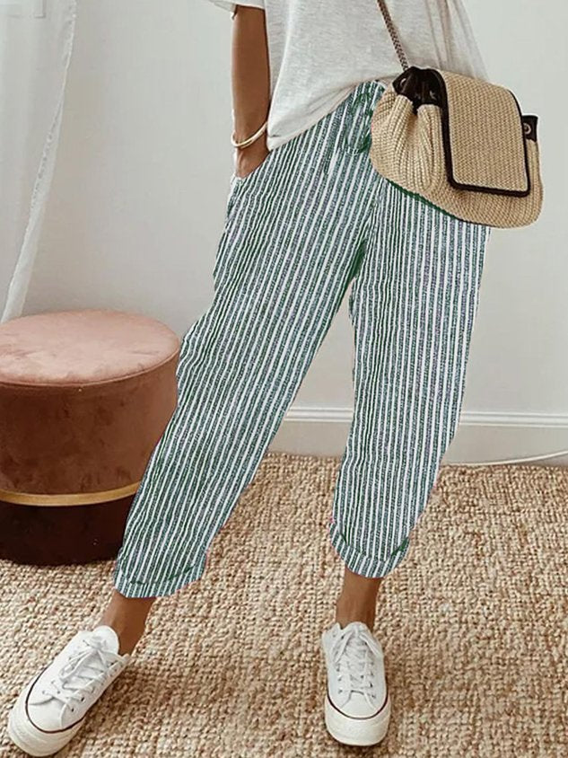 Green striped relaxed drawstring pants with cuffed hem and adjustable waist tie.
