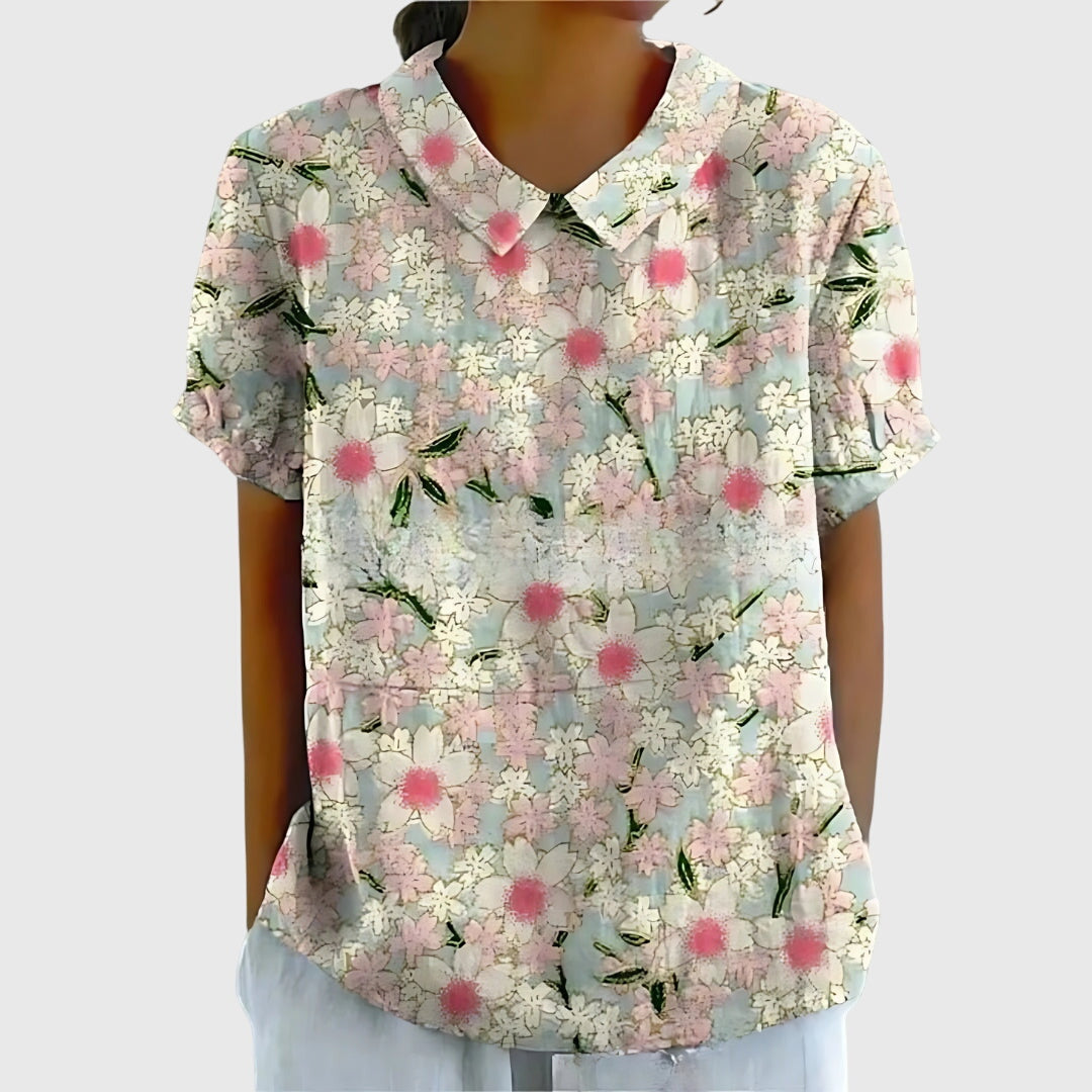 Floral collar blouse in light base with pink floral pom accents, short sleeves
