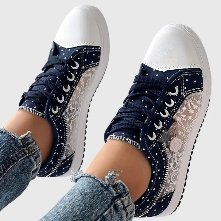Navy lace-up casual sneakers with dark side panels, star pattern and white sole