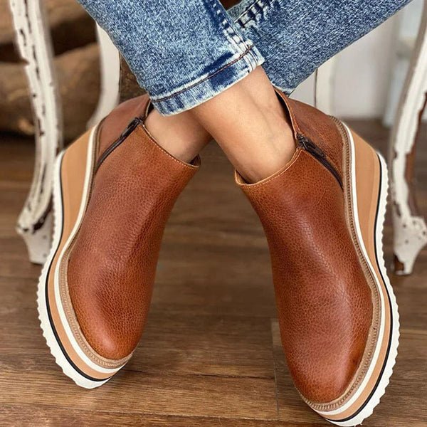 Platform slip-on boots in brown leather with side gore and layered striped platform sole