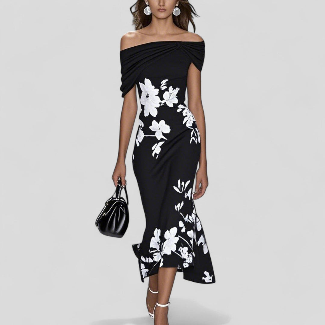 Black printed midi dress with off-shoulder neckline and draped twist front, relaxed fit