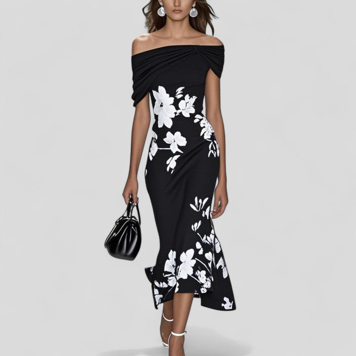 Black printed midi dress with off-shoulder neckline and draped twist front, relaxed fit