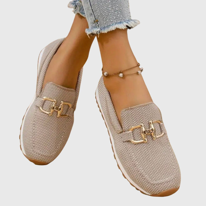 Beige chain-detail slip-on loafers with gold buckle detail and textured fabric