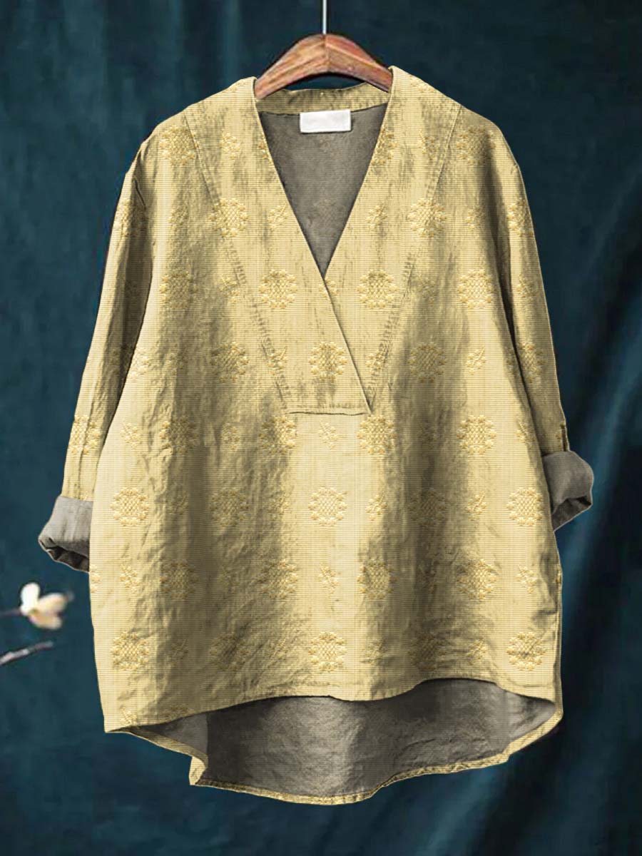 Beige linen blouse with V-neck and all-over floral embroidery, relaxed drape
