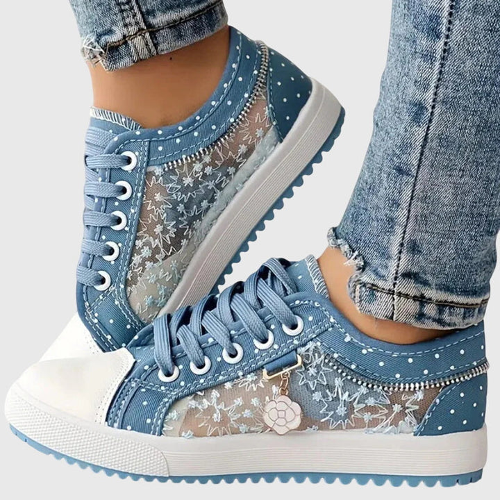 Light blue lace-up casual sneakers with star and flower print, white toe cap