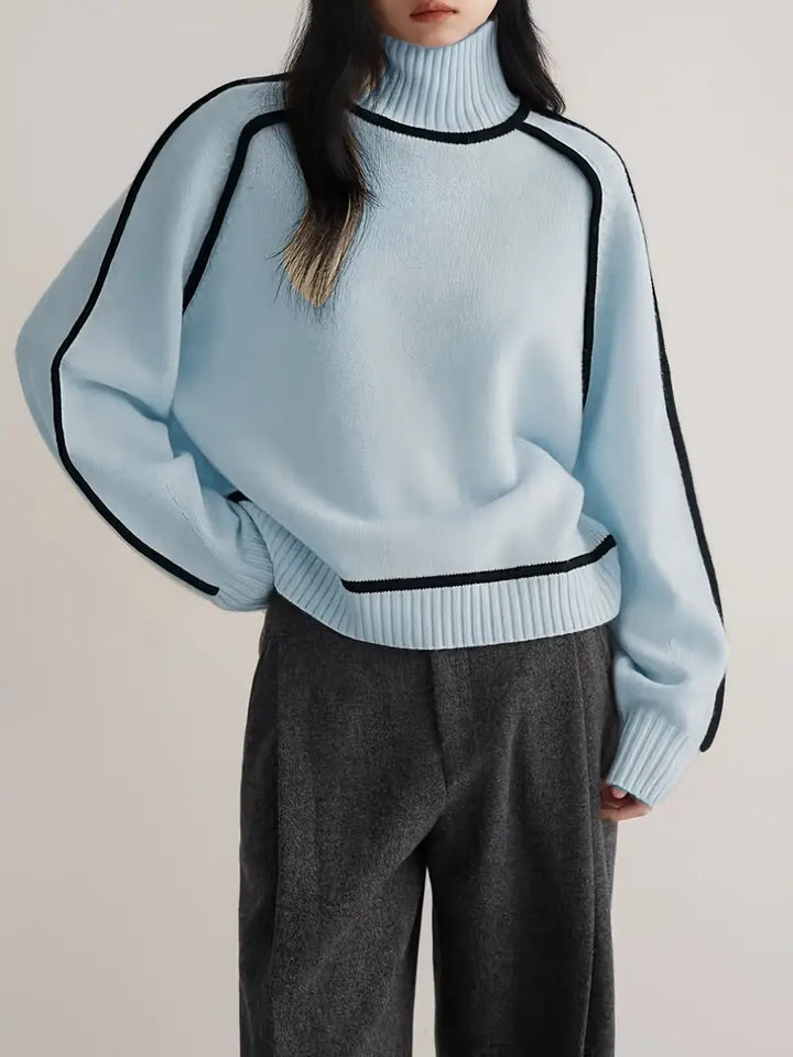 Light blue luxe trim turtleneck sweater with ribbed collar, cuffs, and black trim