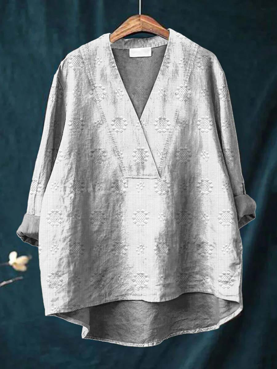 White linen blouse with V-neck and all-over floral embroidery, relaxed fit