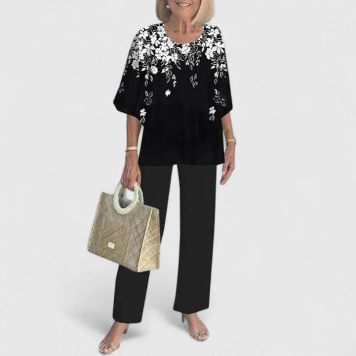 Two-piece blouse and trousers set, black blouse with white floral print and black trousers