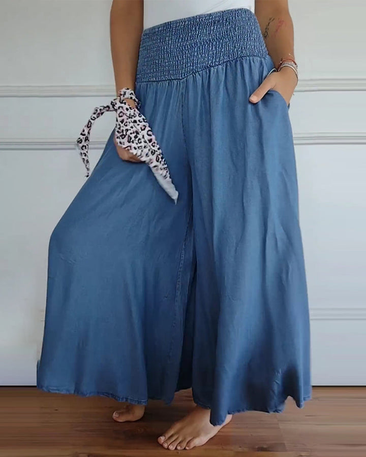 Blue wide-leg pants with smocked elastic waistband and loose flowy fit