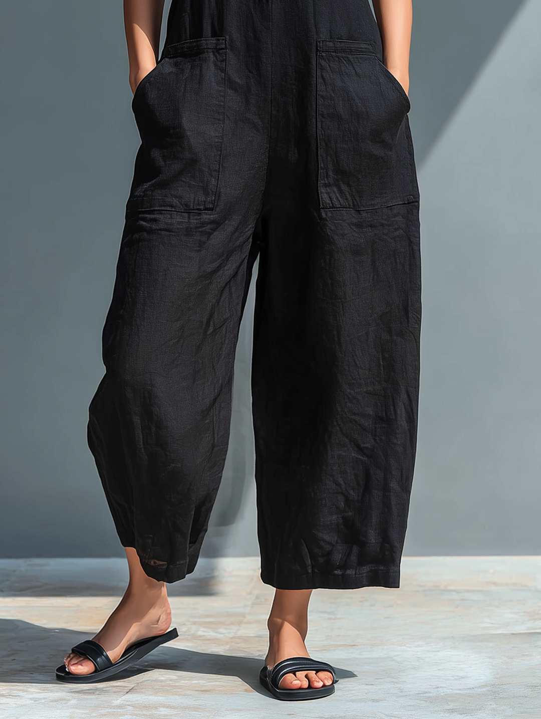 Black linen-blend button jumpsuit, cropped wide-leg pants with side pockets