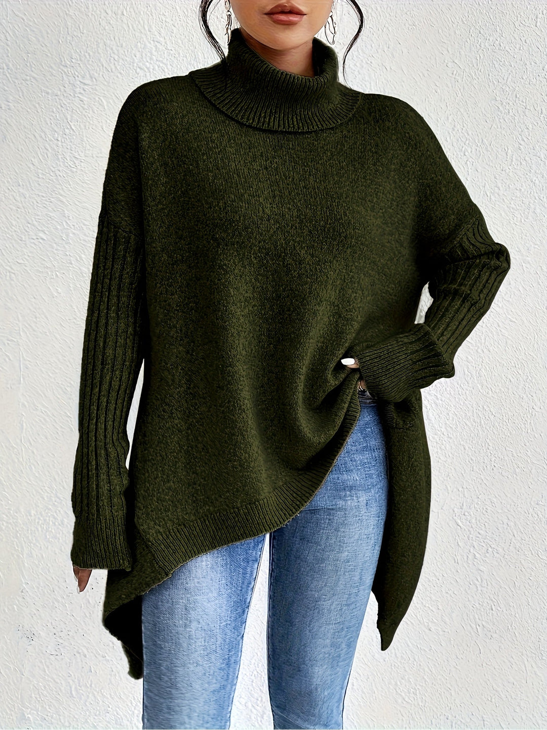 Olive green oversized turtleneck knit sweater with ribbed cuffs and asymmetrical hem