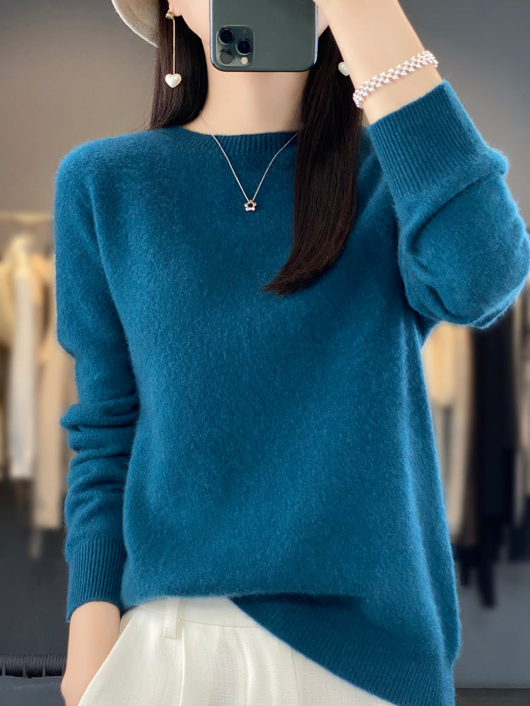 Soft knit pullover sweater in blue with buttoned round neckline and long sleeves