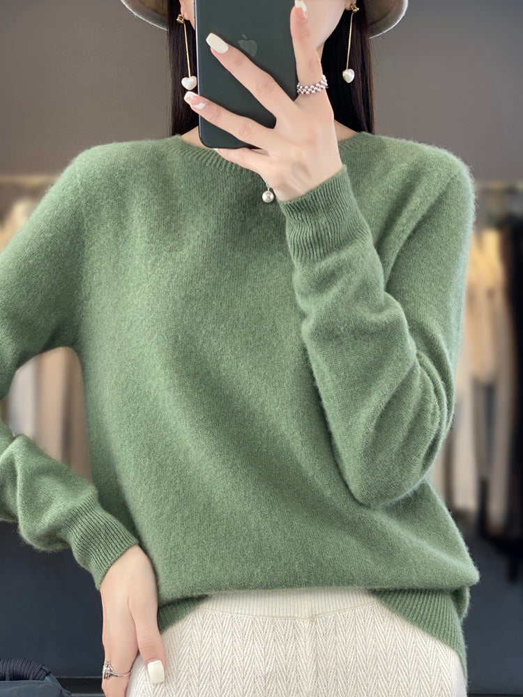 Soft knit pullover sweater in green with buttoned round neckline and long sleeves