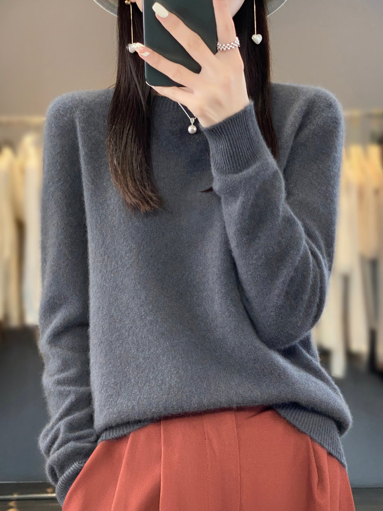 Soft knit pullover sweater in dark gray with buttoned round neckline and long sleeves