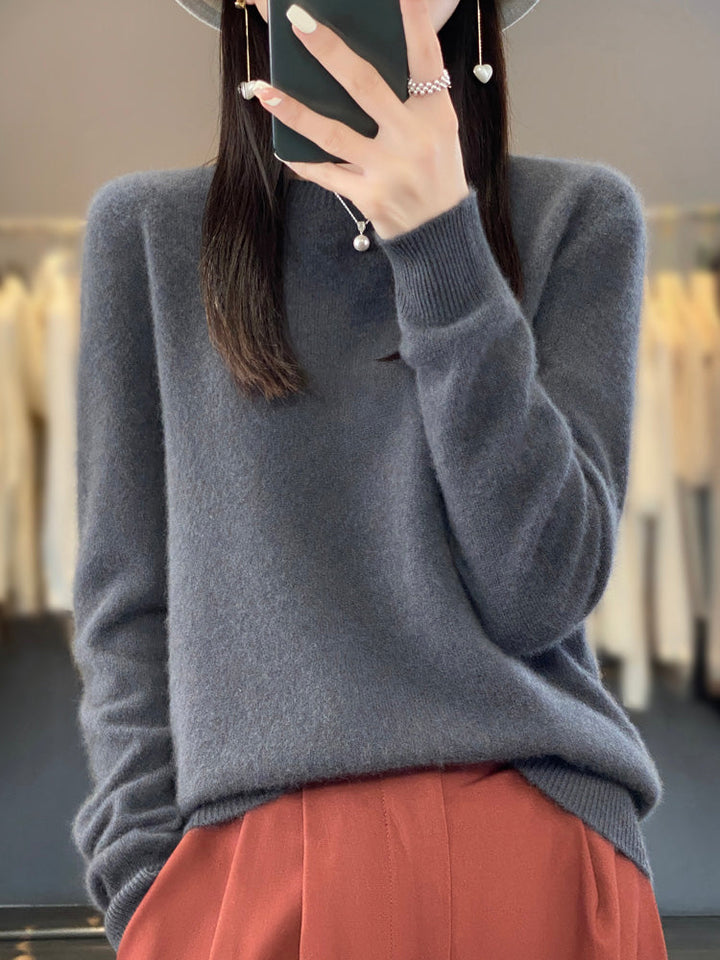 Soft knit pullover sweater in dark gray with buttoned round neckline and long sleeves