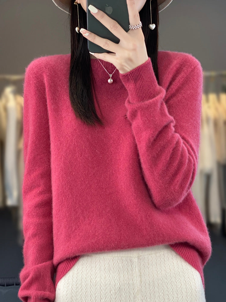Soft knit pullover sweater in raspberry red with buttoned round neckline and long sleeves