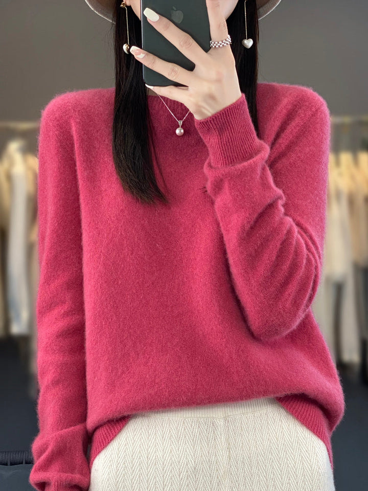 Soft knit pullover sweater in raspberry red with buttoned round neckline and long sleeves