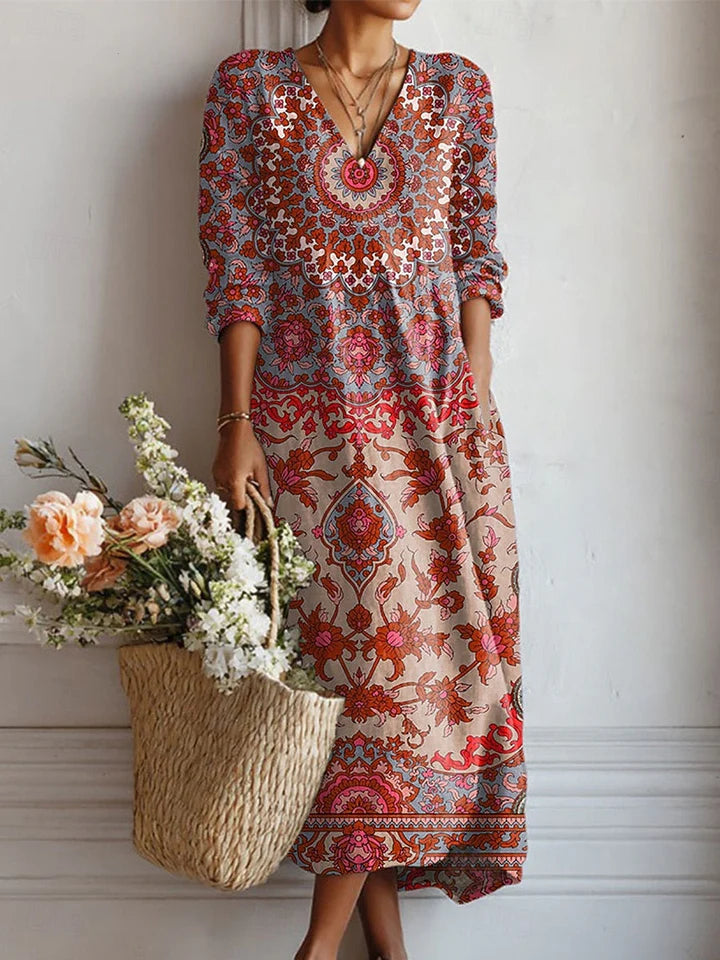 Floral everyday comfort dress with V neckline, long sleeves, and tiered midi hem