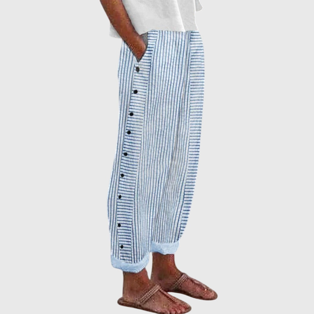 Blue striped button-front pants with elastic ankle cuffs and vertical button placket