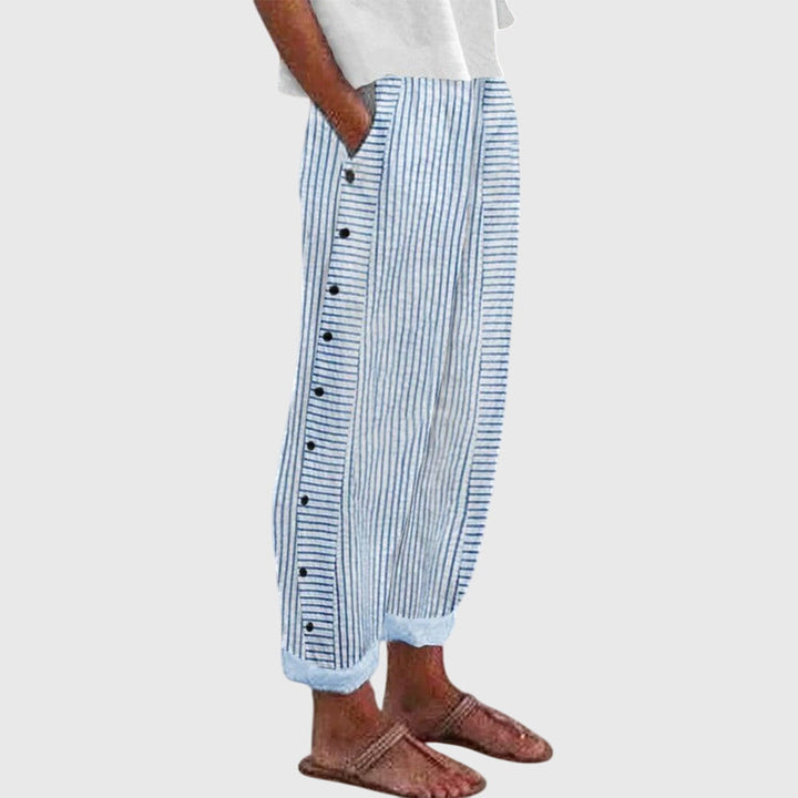 Blue striped button-front pants with elastic ankle cuffs and vertical button placket