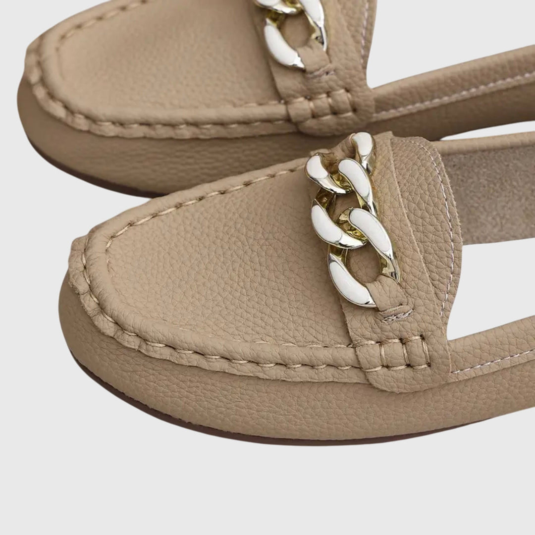 Beige Kris slip-on loafer close-up with metal chain link detail and top stitching
