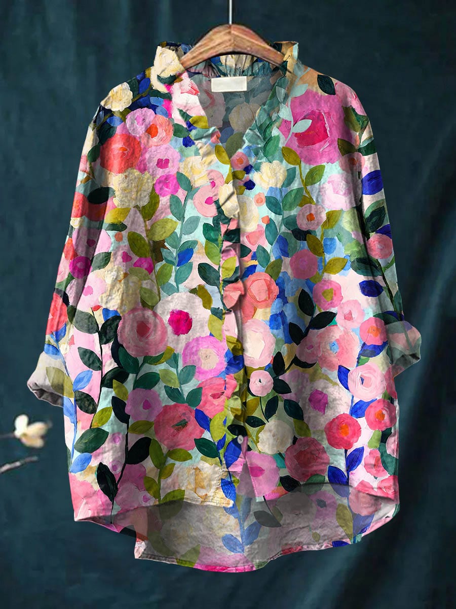 Relaxed linen blouse with multicolor floral print, button-front, collar, and long sleeves
