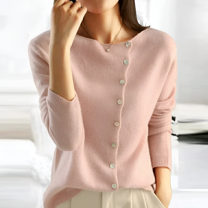 Pink button-front knit sweater with V-neck and long sleeves, ribbed cuffs